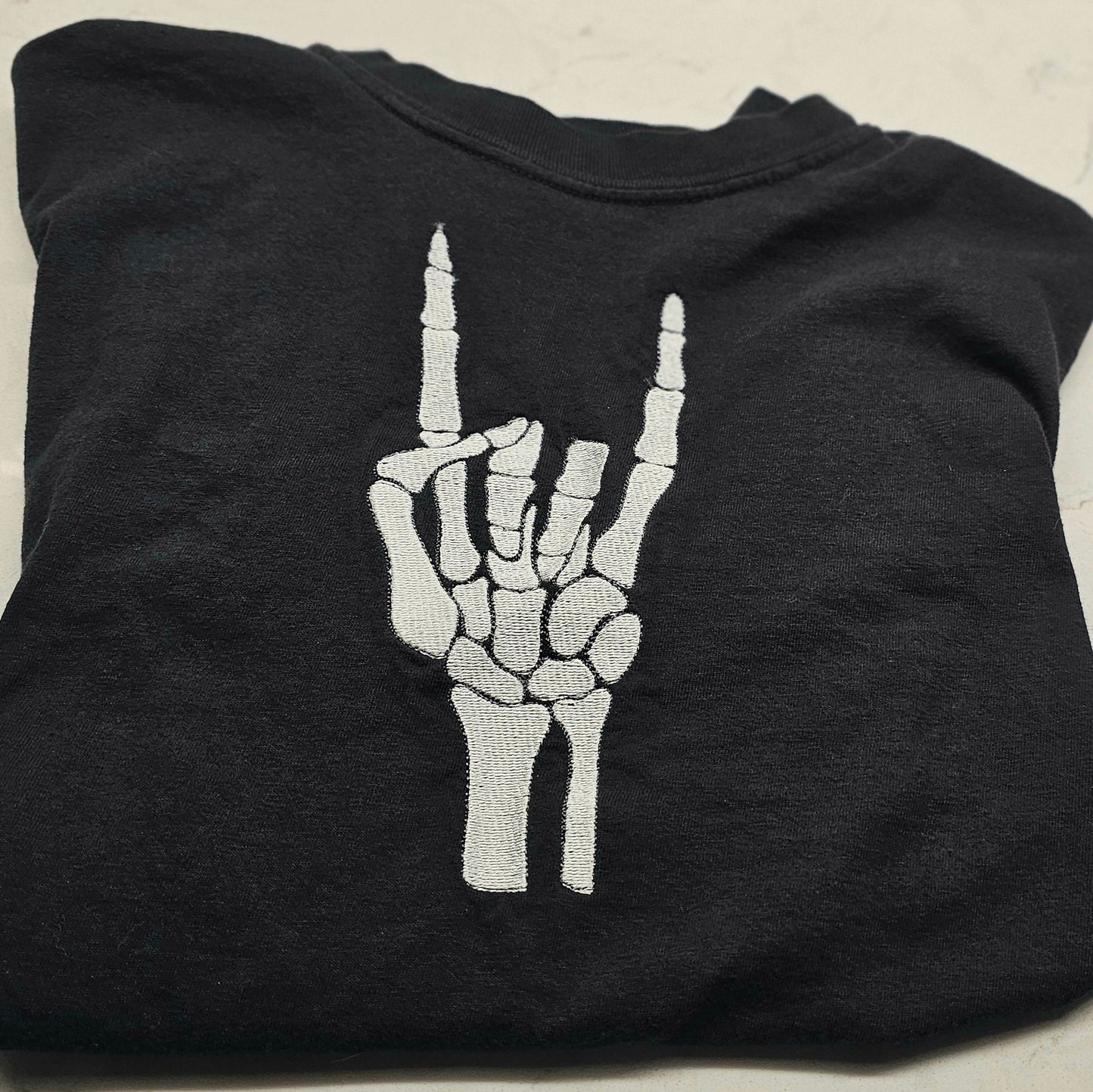 Embroidered Skeleton Rock on Hands Comfort Colors Tee