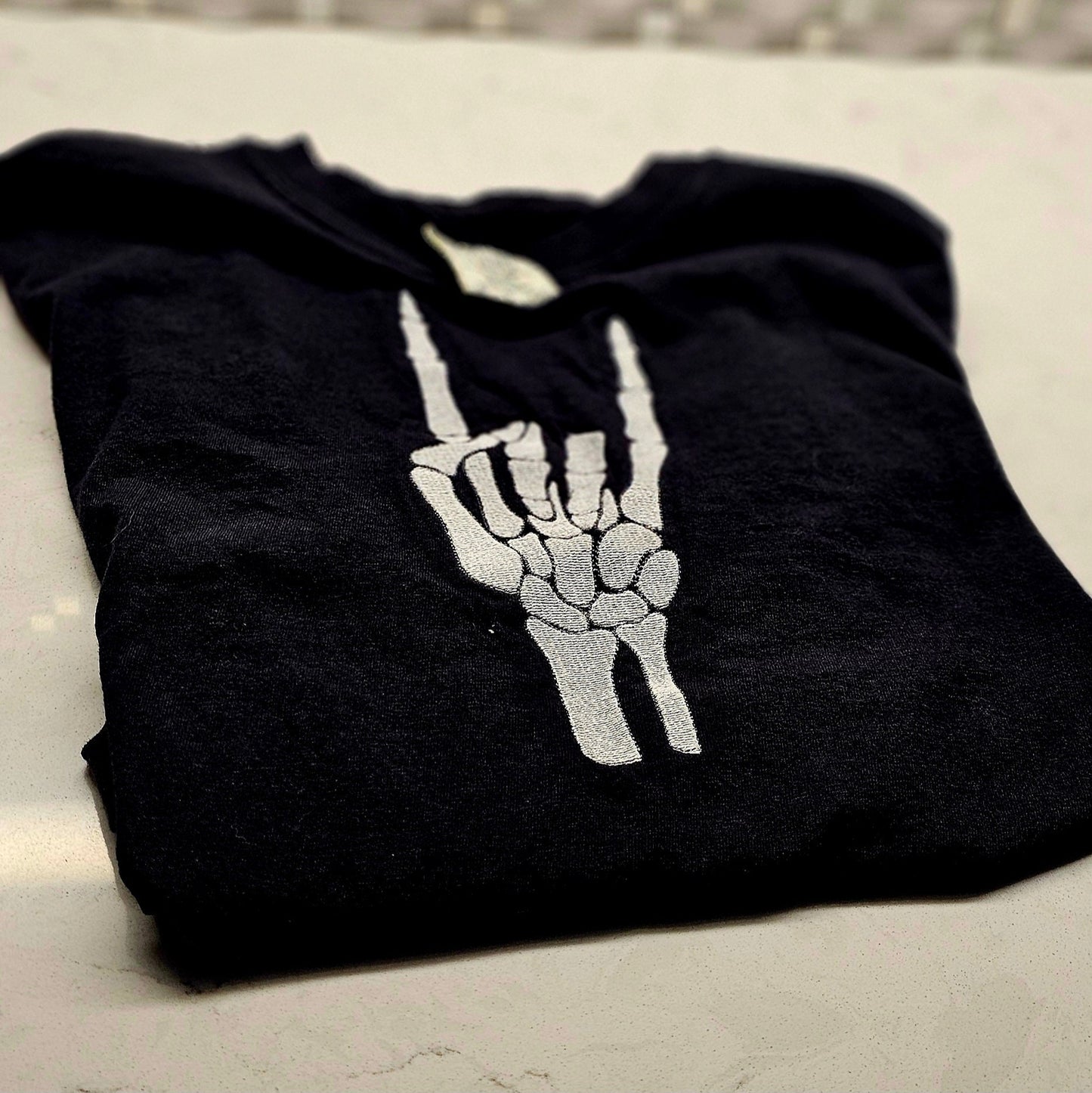 Embroidered Skeleton Rock on Hands Comfort Colors Tee