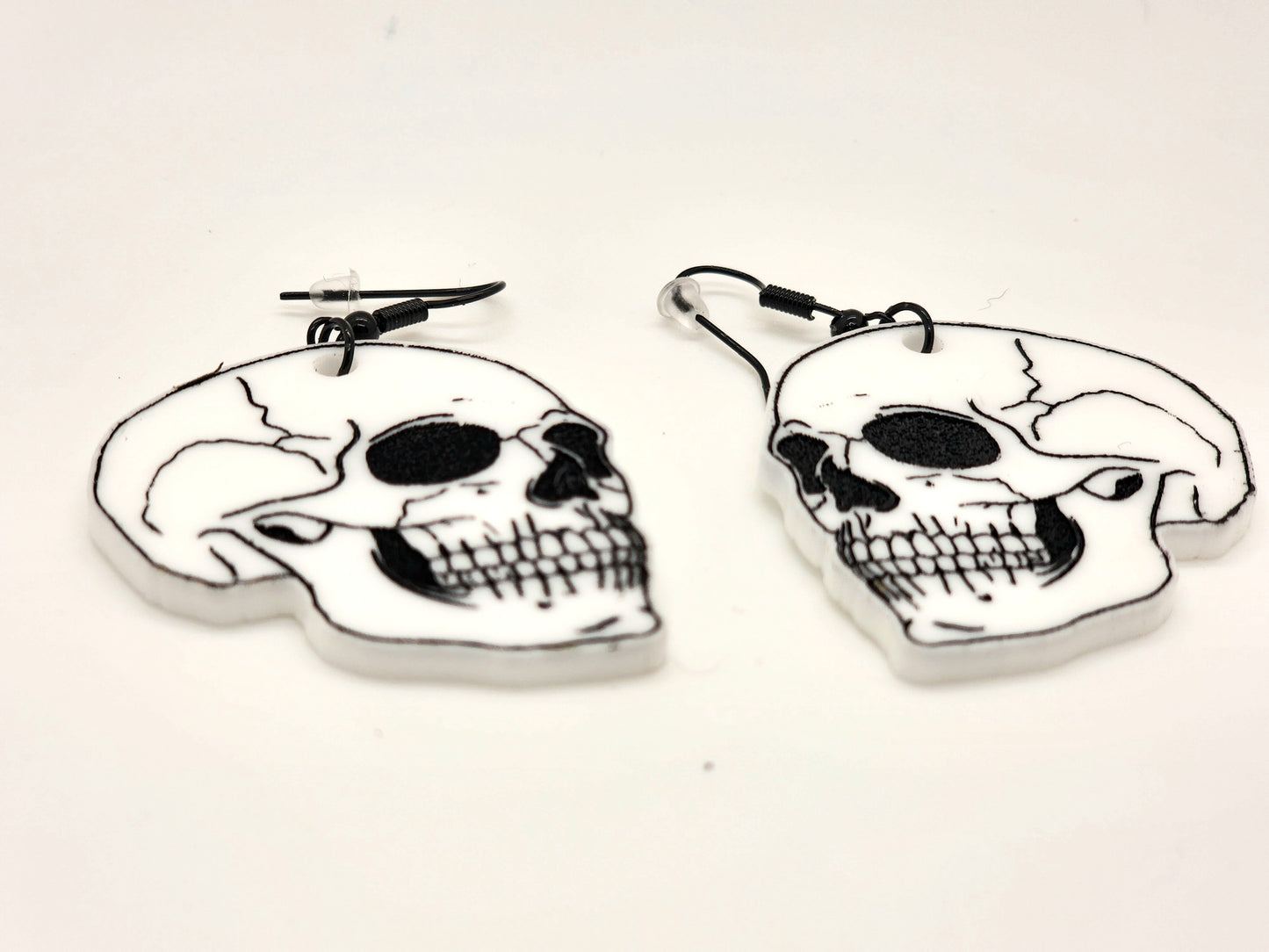 Make a statement with these one-of-a-kind gothic skull earrings – perfect for adding a touch of edge to your look.